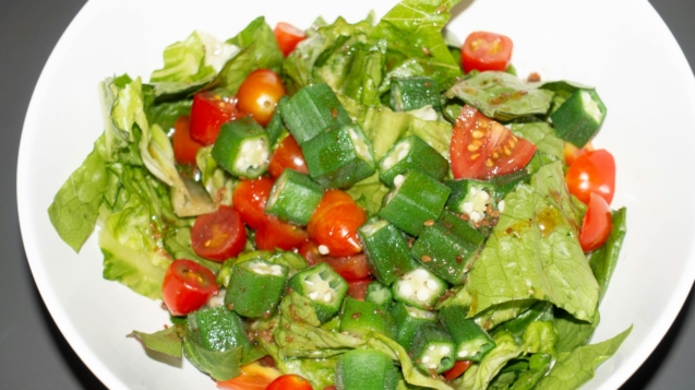 Delicious healthy salad with okra, tomatoes, and lettuce perfect for a fresh meal.